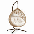 Poltrona sospesa in rattan sintetico beige con cuscino crema e supporto marrone, 105 × 105 × 195 cm